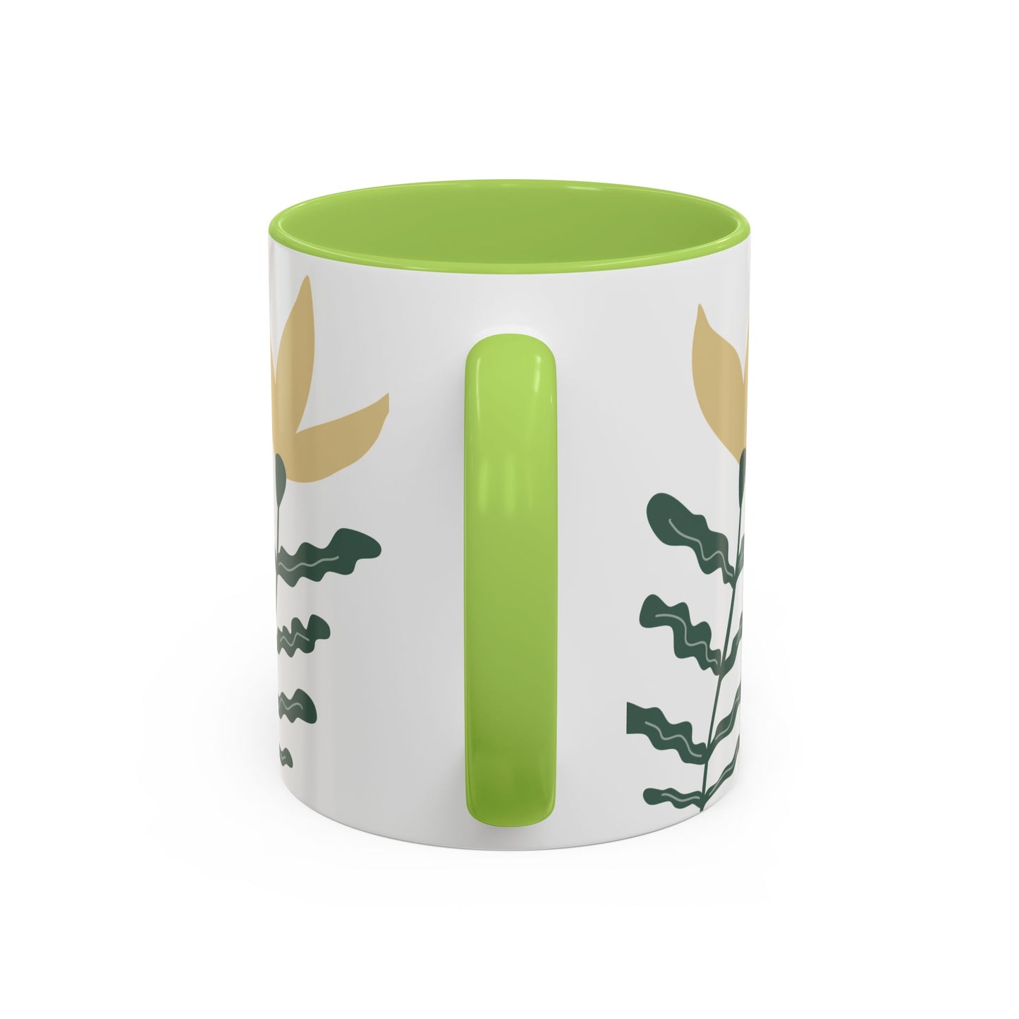 White mug with green interior and handle, featuring leaf patterns on a white background