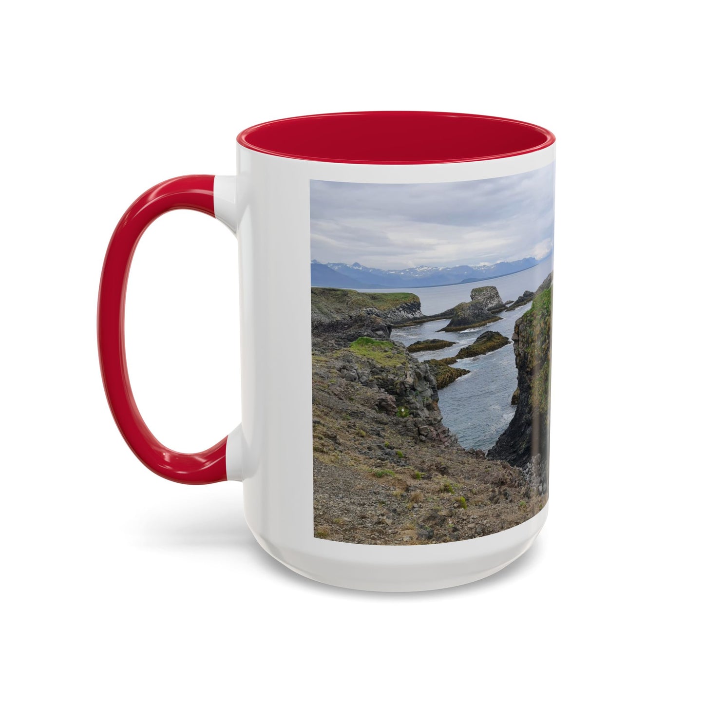 Mug with a scenic landscape of cliffs and water on a white background
