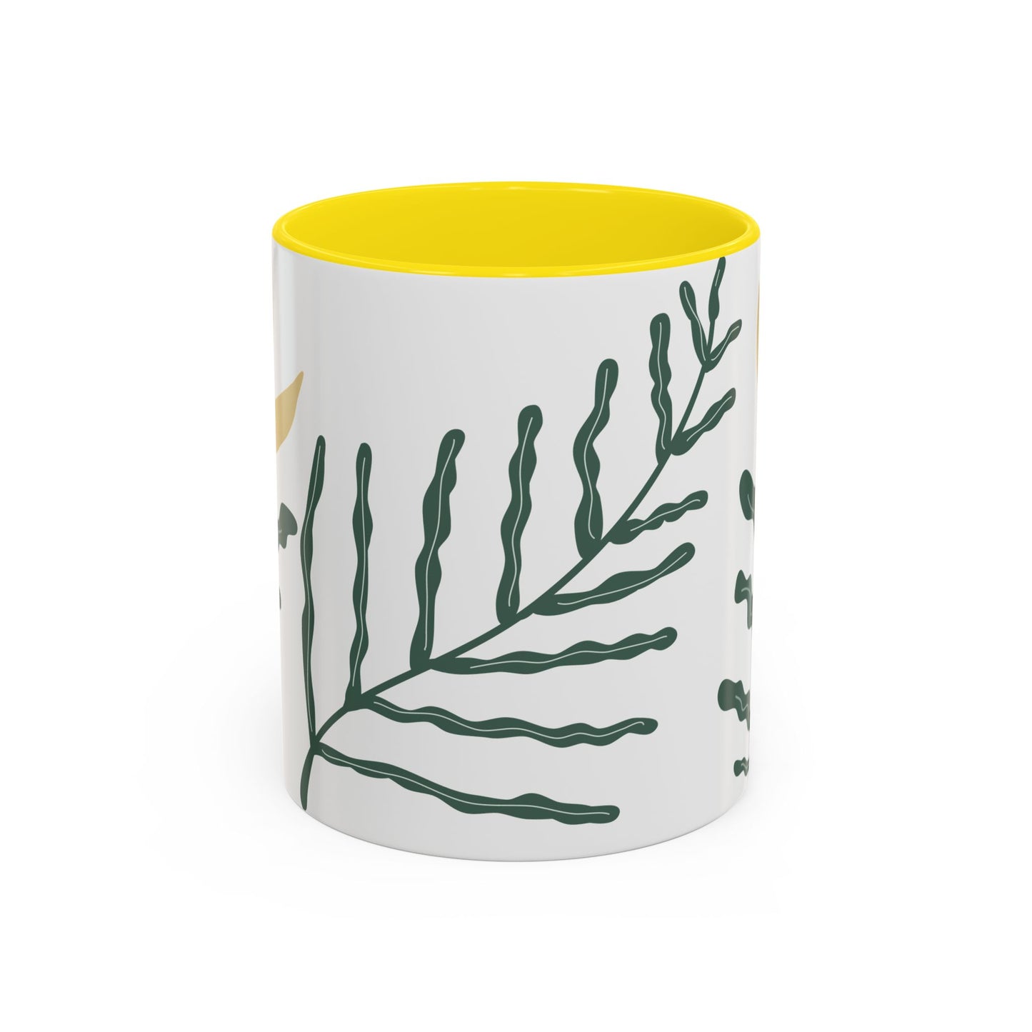 Mug with green leaf pattern and yellow interior on a white background