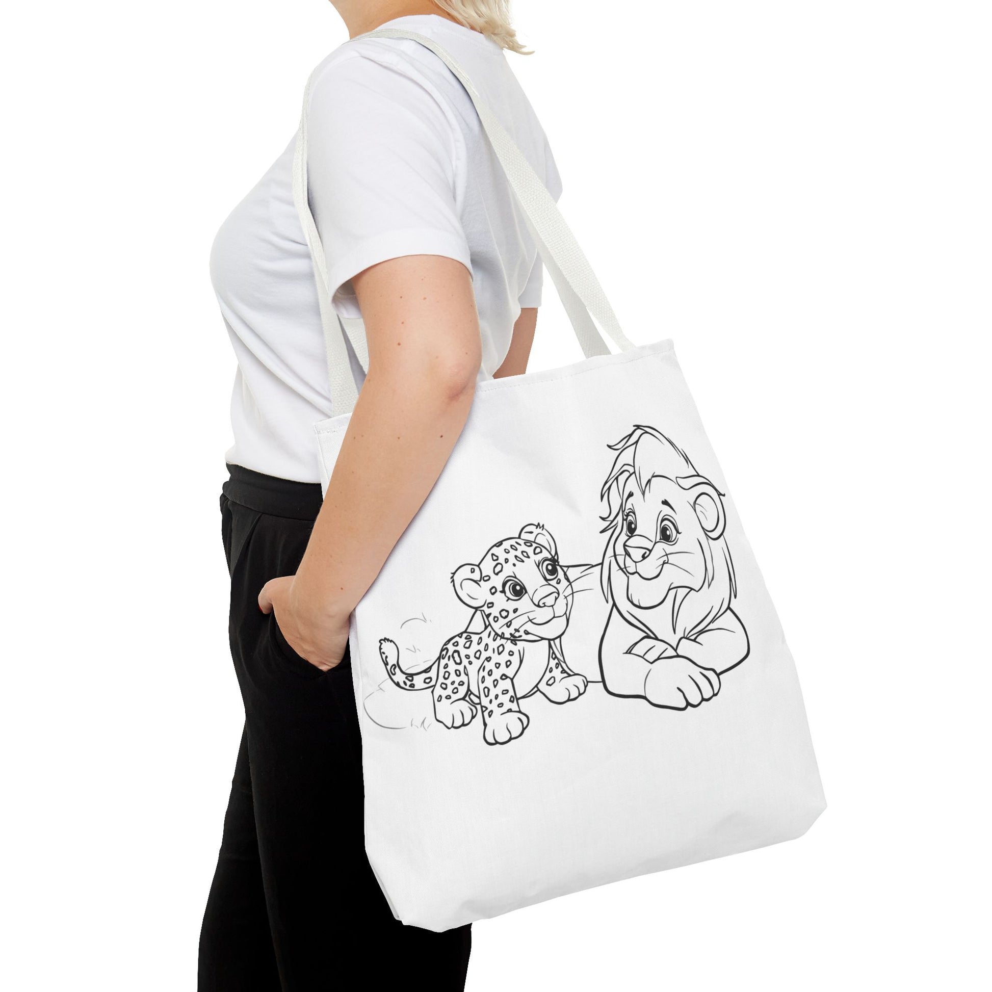 Person holding a tote bag with cartoon characters on a white background