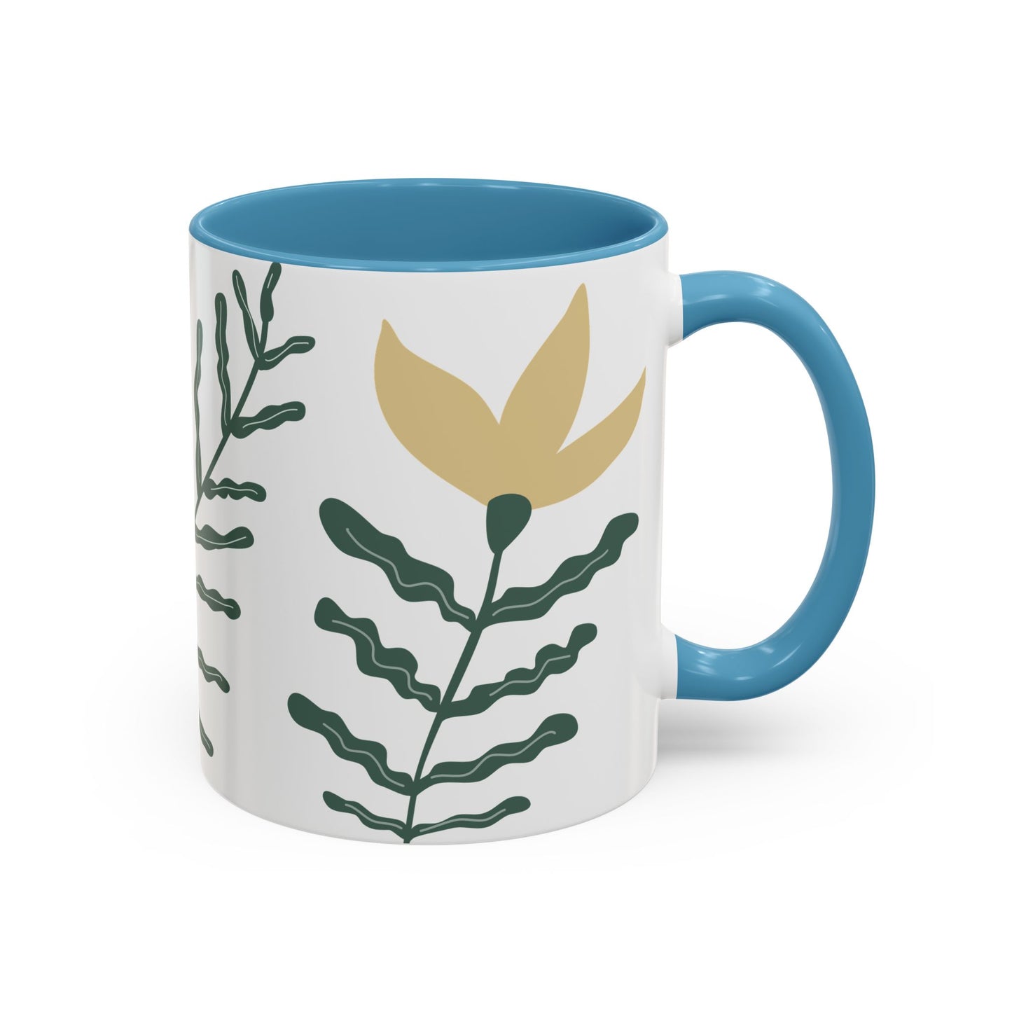 Mug with blue interior and handle, featuring a leaf design on a white background