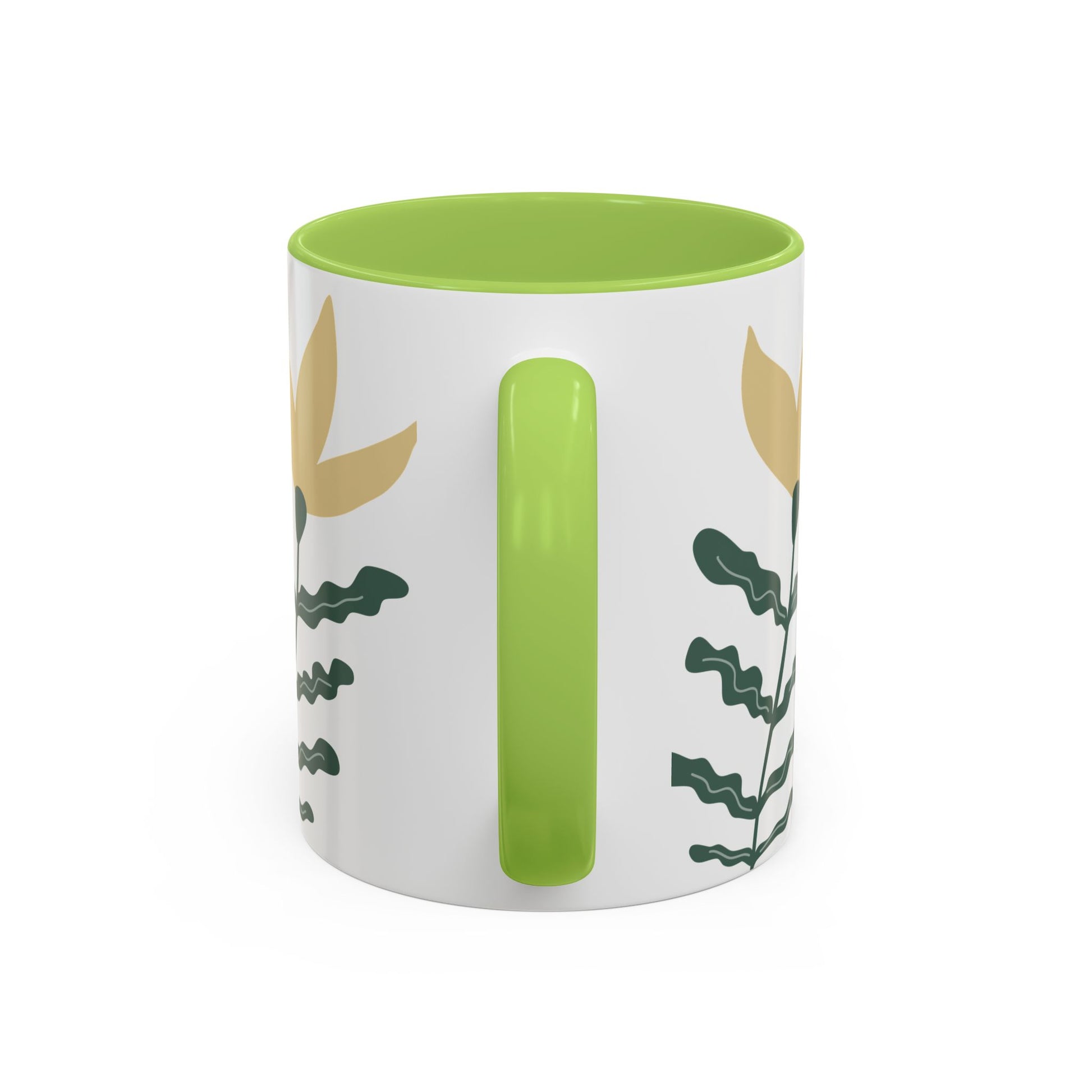 White mug with green interior and handle, featuring leaf patterns on a white background