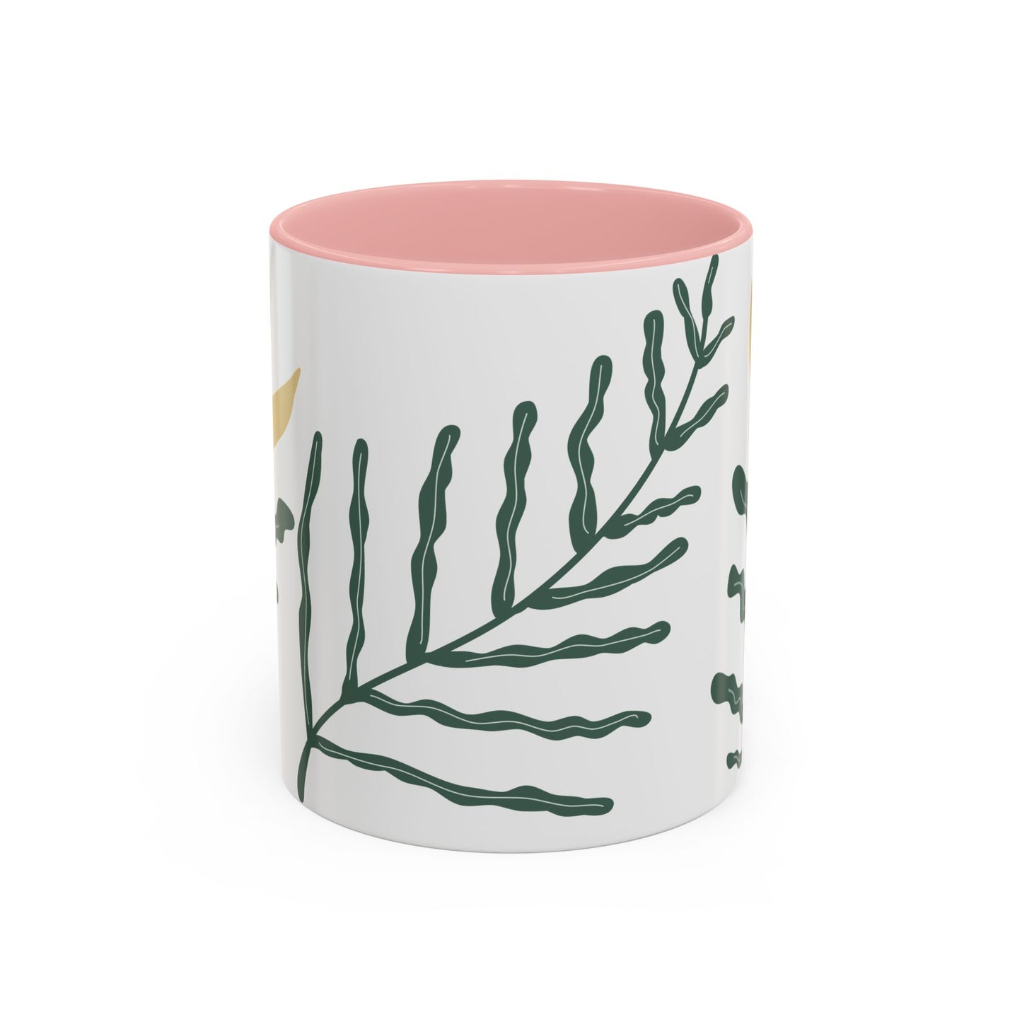 Mug with green leaf design and pink interior on a white background
