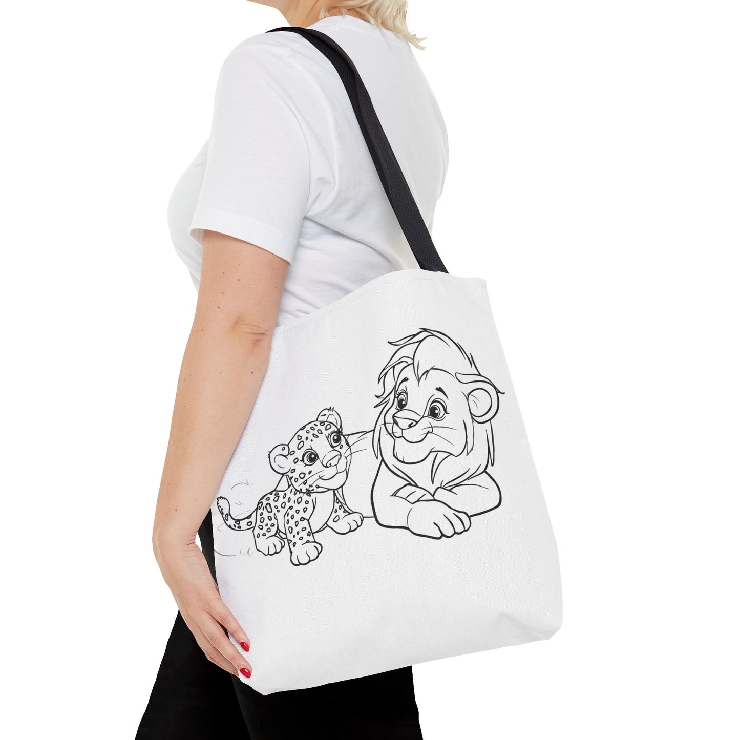 Person holding a tote bag with cartoon lion and cub design on a white background