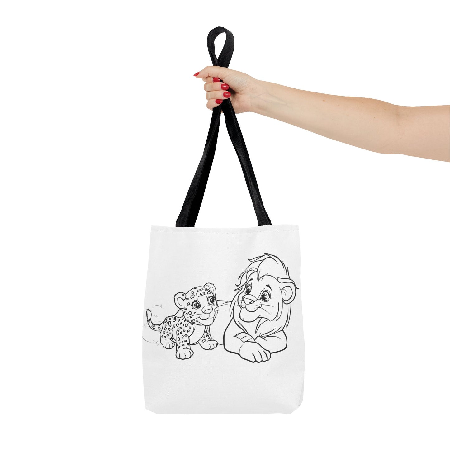Tote bag with cartoon characters held by a hand on a white background