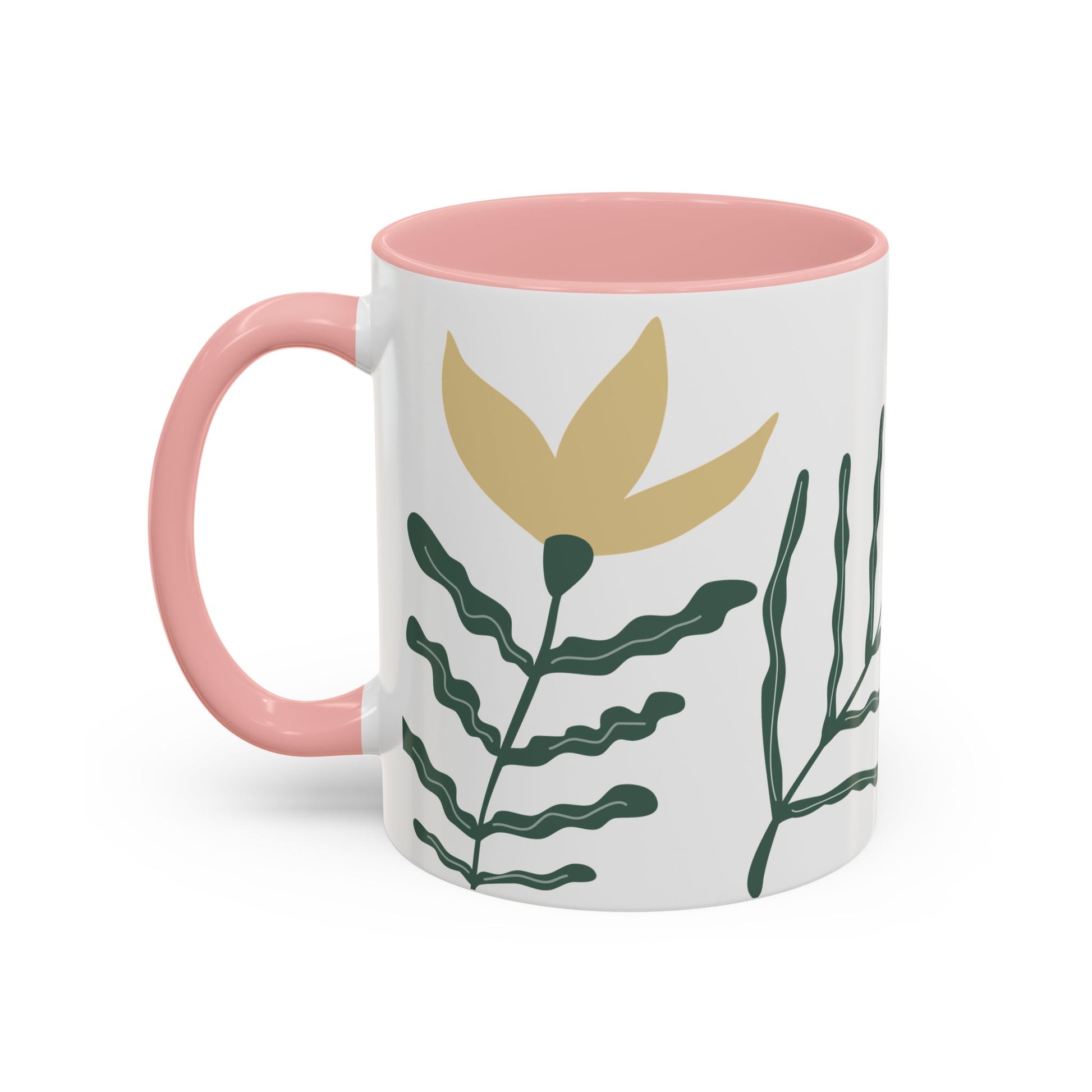 Mug with pink interior and handle, featuring a gold leaf and green plant design on a white background