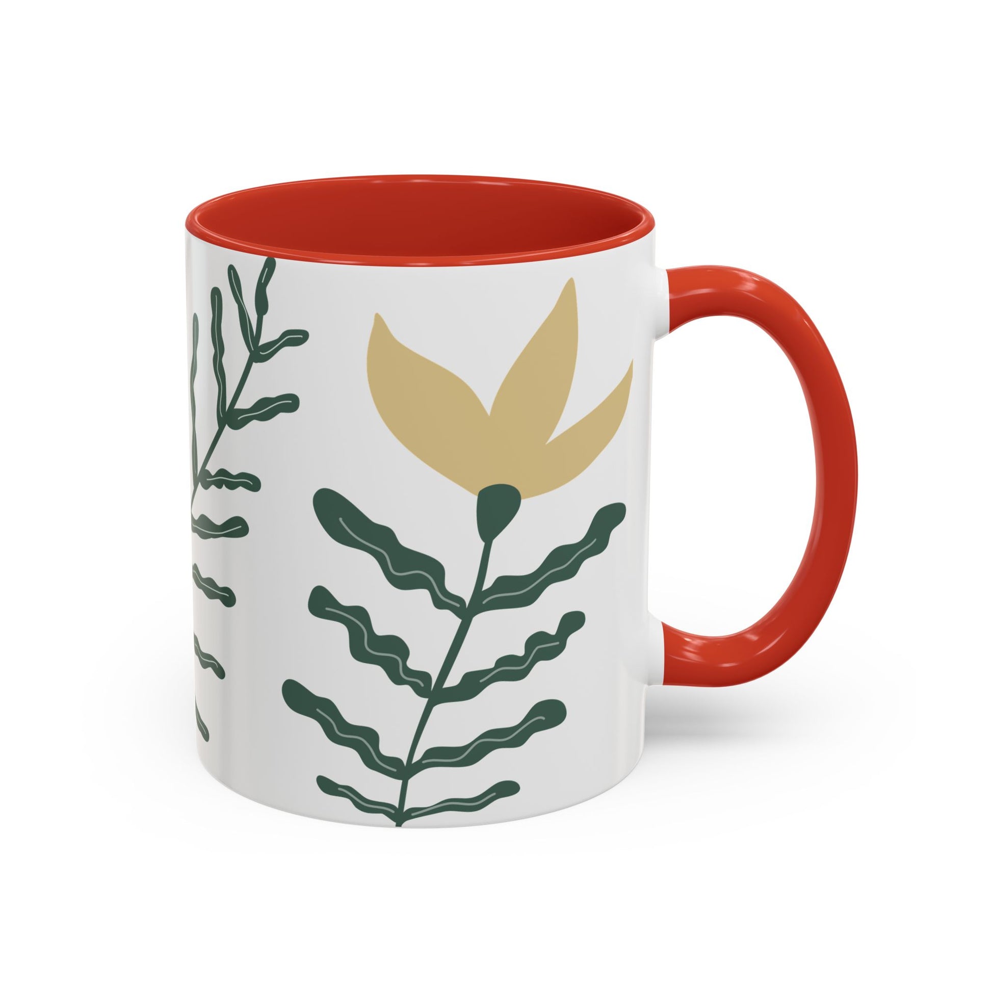 Mug with red interior and handle, featuring green leaf patterns on a white background