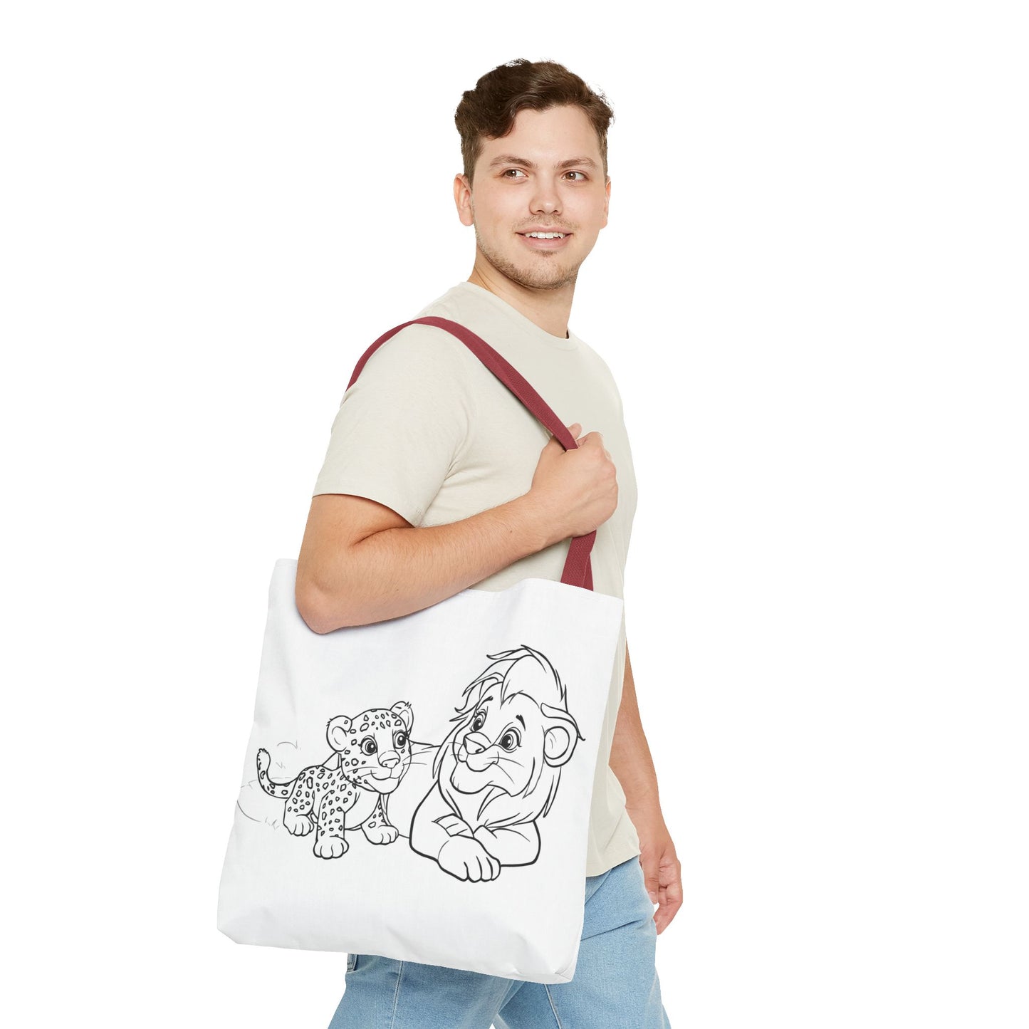 Man holding a tote bag with a cartoon design of a leopard and a bear on a white background