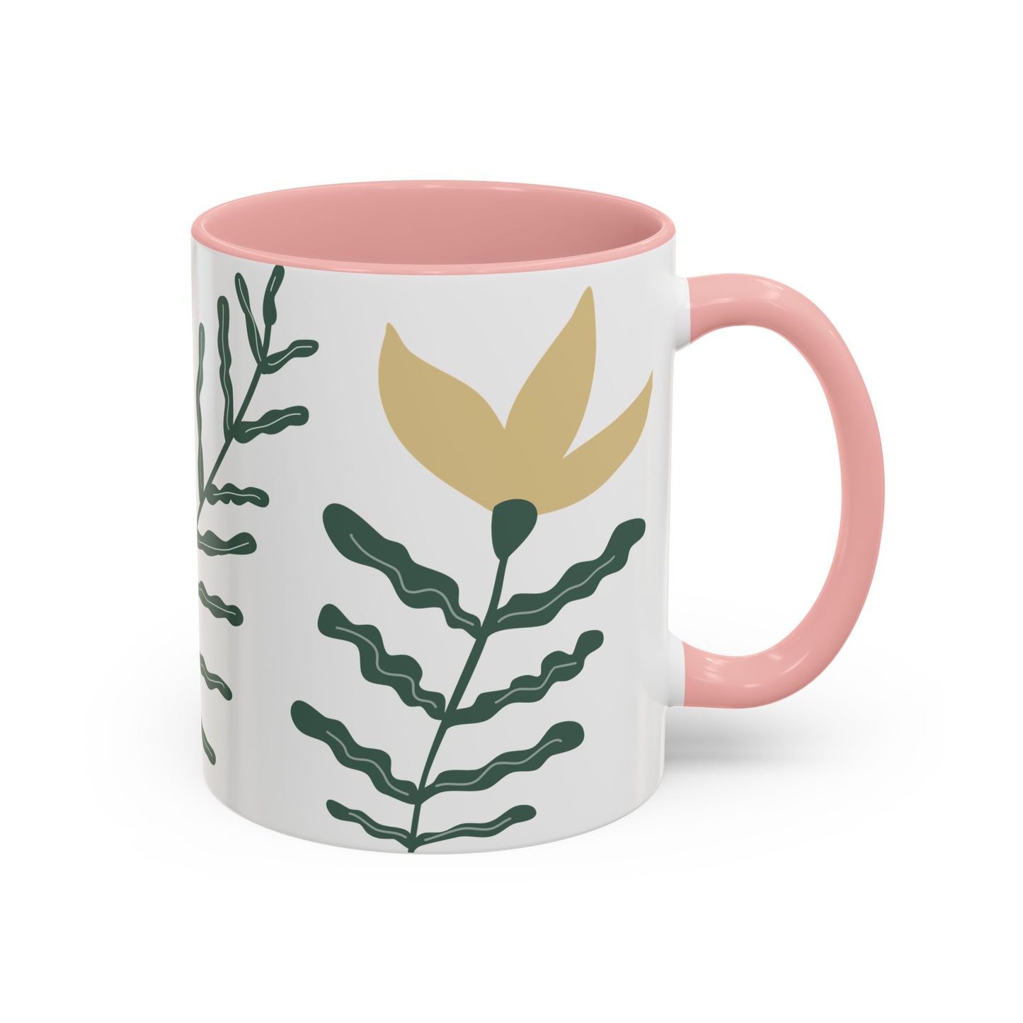 Mug with pink interior and handle, featuring green leaf design on a white background
