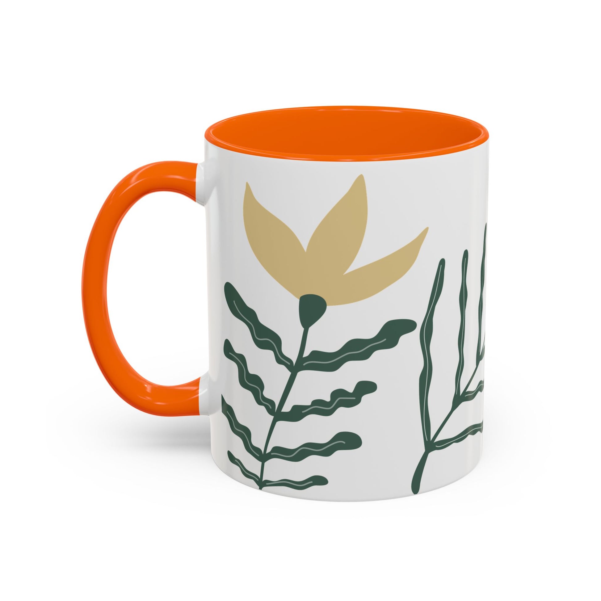 Mug with orange handle and interior, featuring leaf designs on a white background