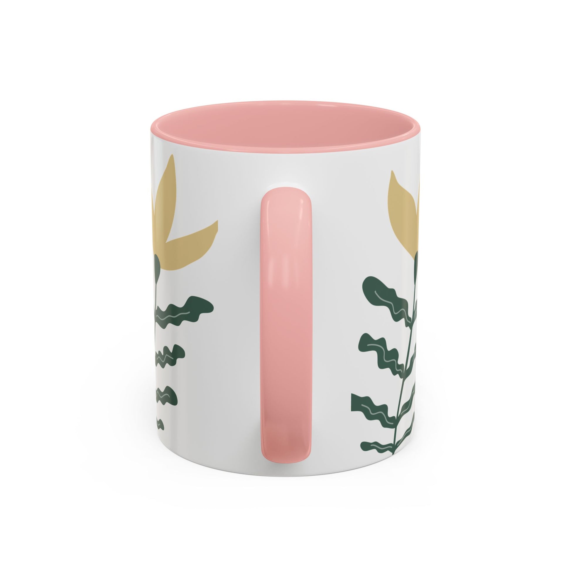 Mug with pink interior and handle, featuring leaf patterns on a white background