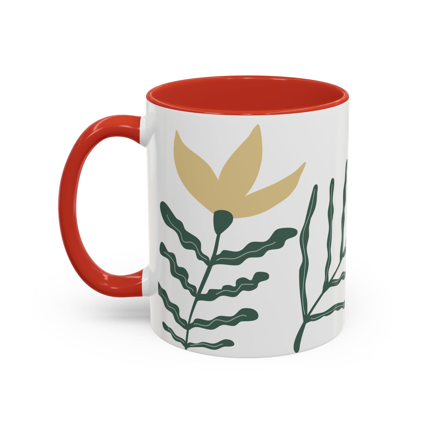 Mug with red interior and handle, featuring a plant design on a white background