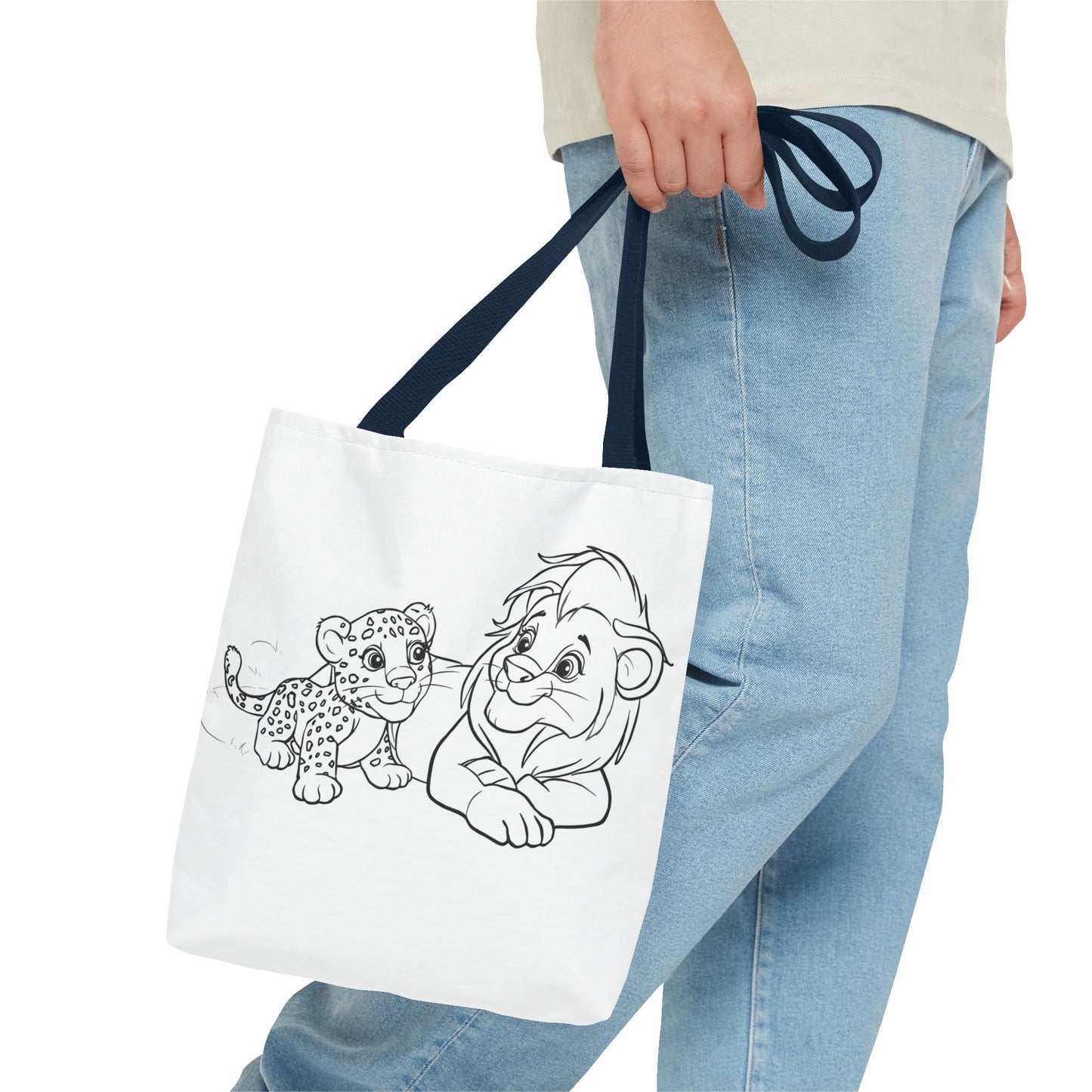 Person holding a tote bag with black line art of a leopard and a character on a white background