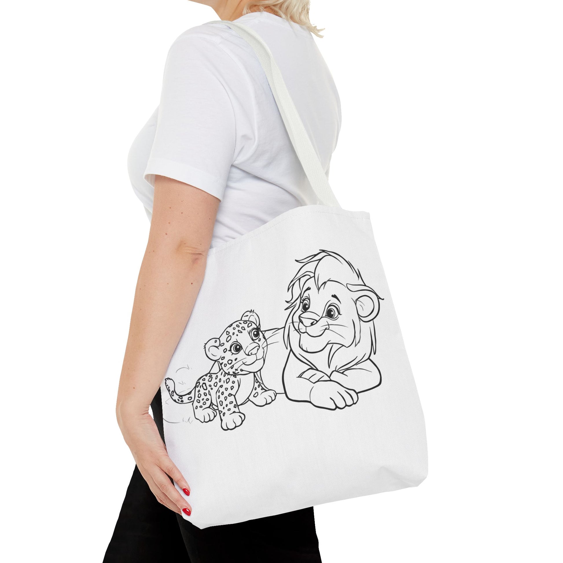 Person holding a tote bag with cartoon lion and cub design on a white background