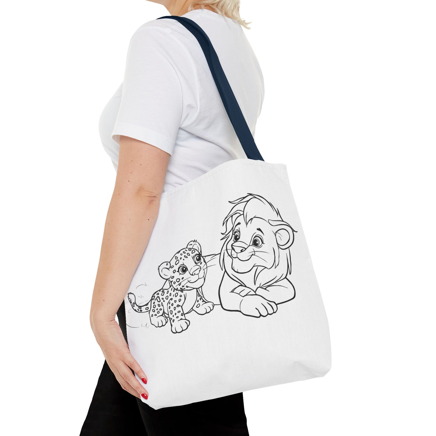 Person holding a tote bag with cartoon lion and cub design on a white background