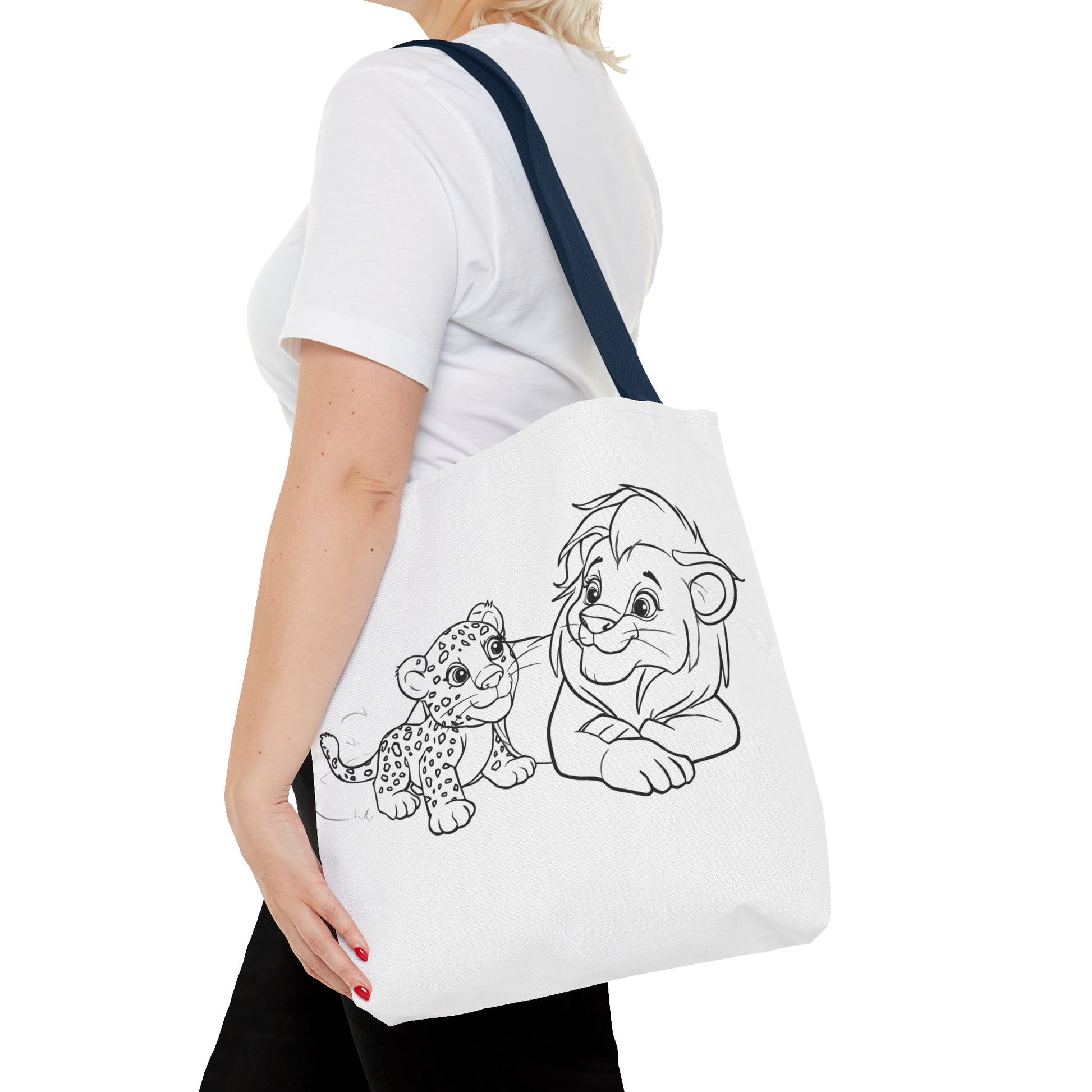 Person holding a tote bag with cartoon lion and cub design on a white background