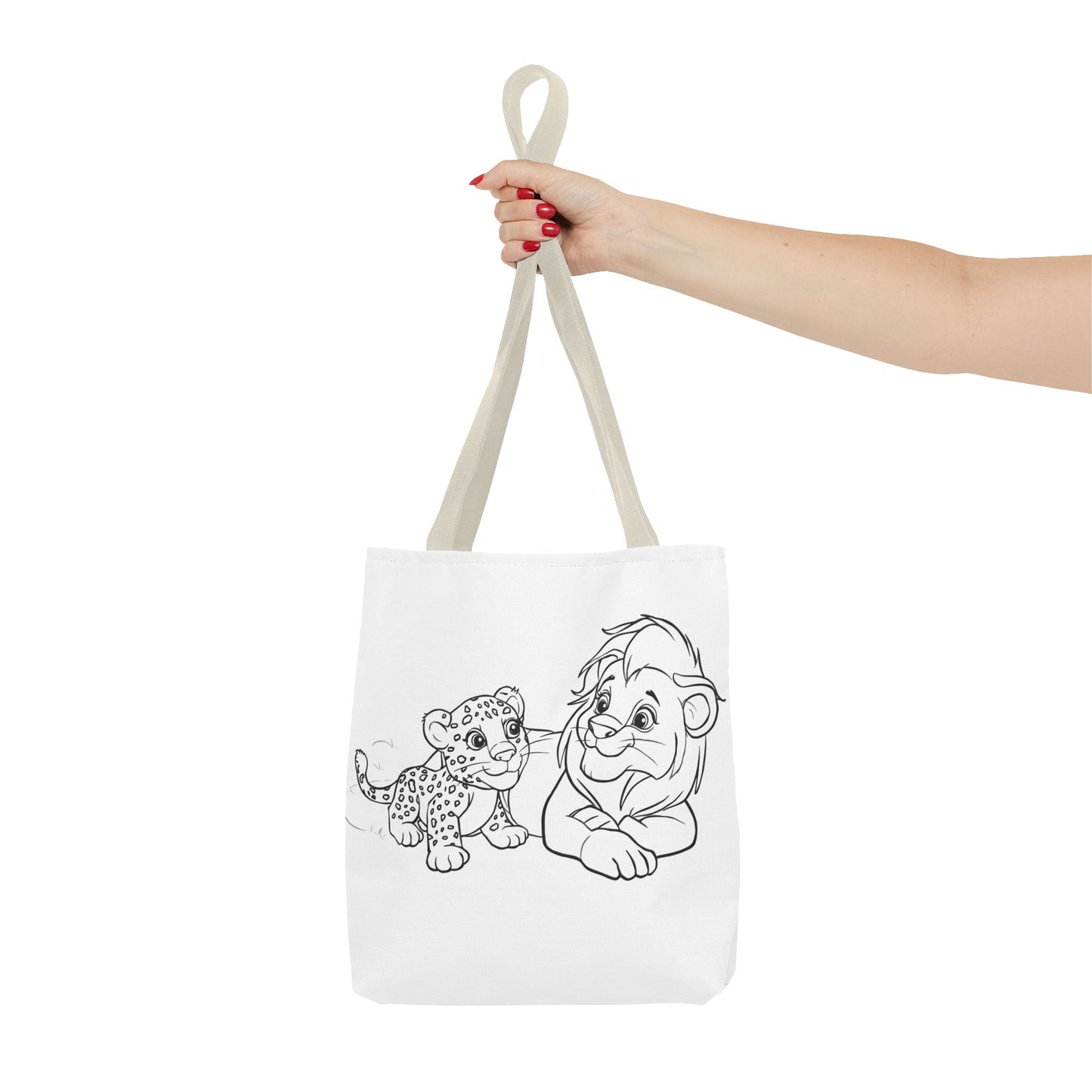 Tote bag with illustrations of a lion and a cub held by a hand on a white background