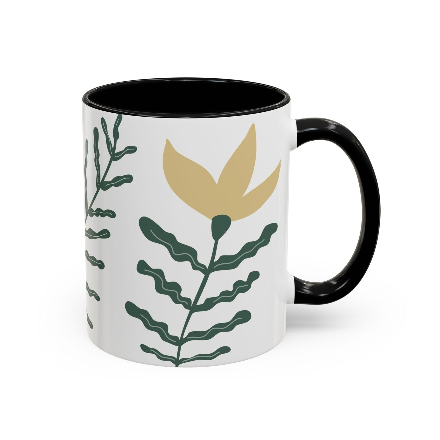 Mug with black interior and handle, featuring a gold leaf and green foliage design on a white background.